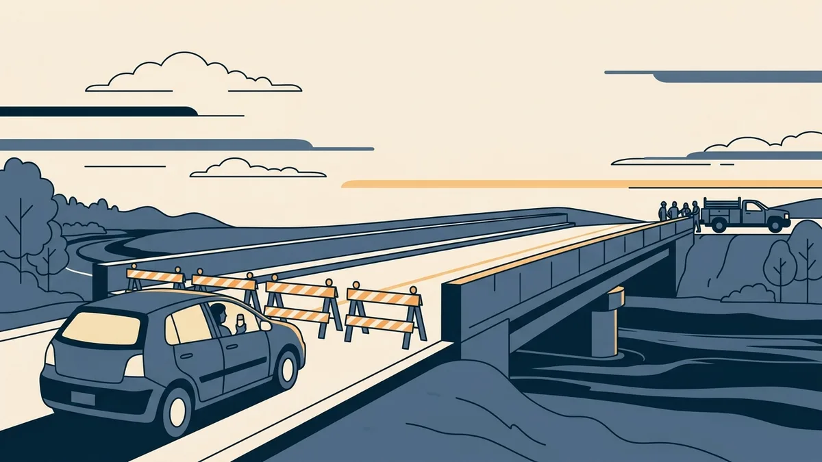 A newly built bridge with construction barriers still blocking the entrance and a social worker's car waiting at the barrier.